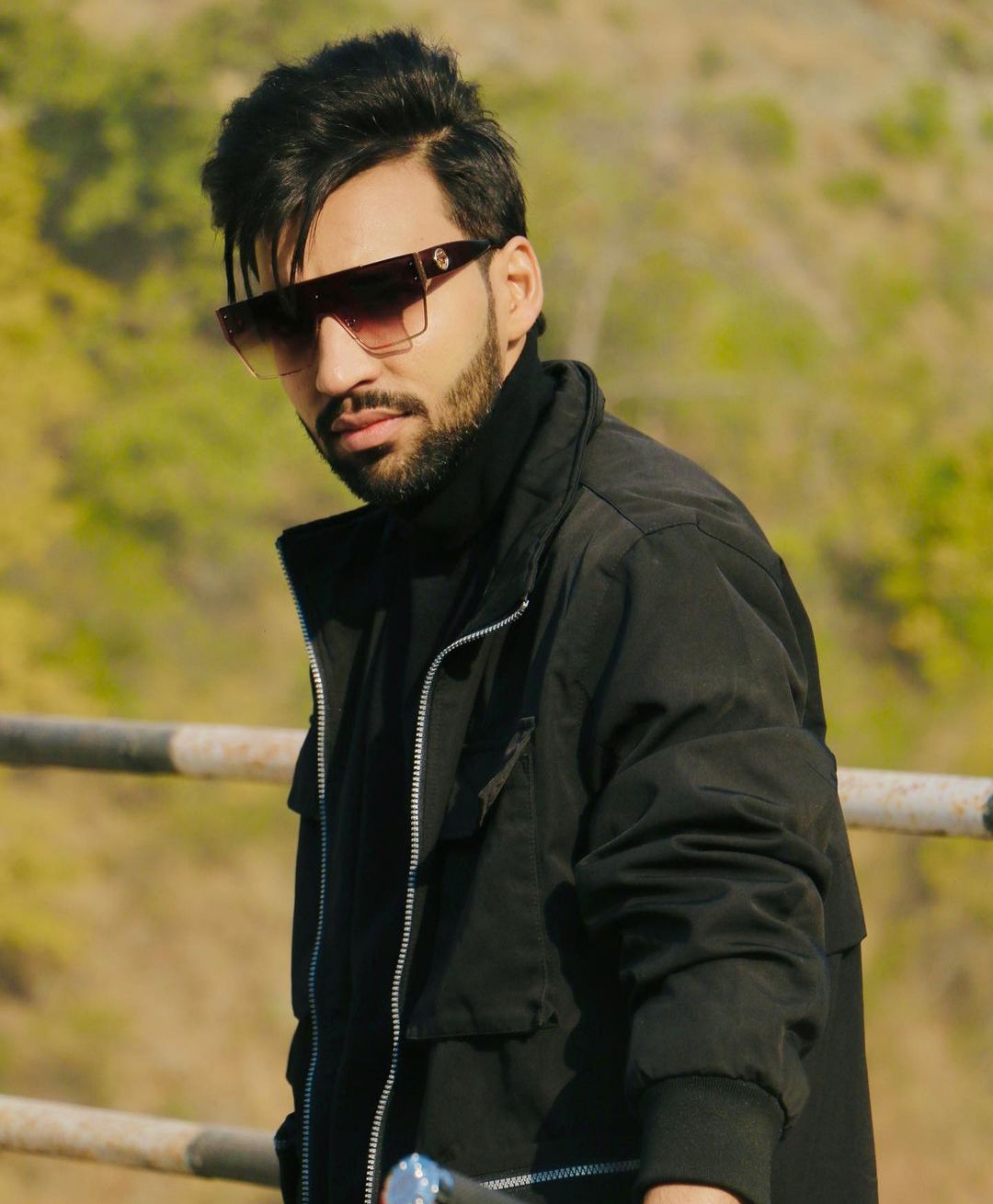 Outdoor portrait of Revaansh Kohli in sunglasses and a black jacket