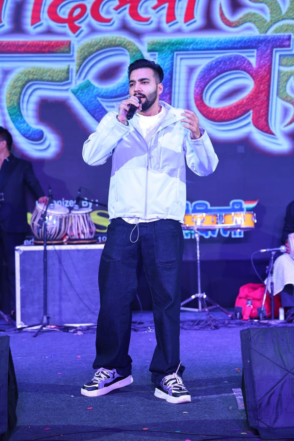 Full-length shot of Revaansh Kohli performing on stage