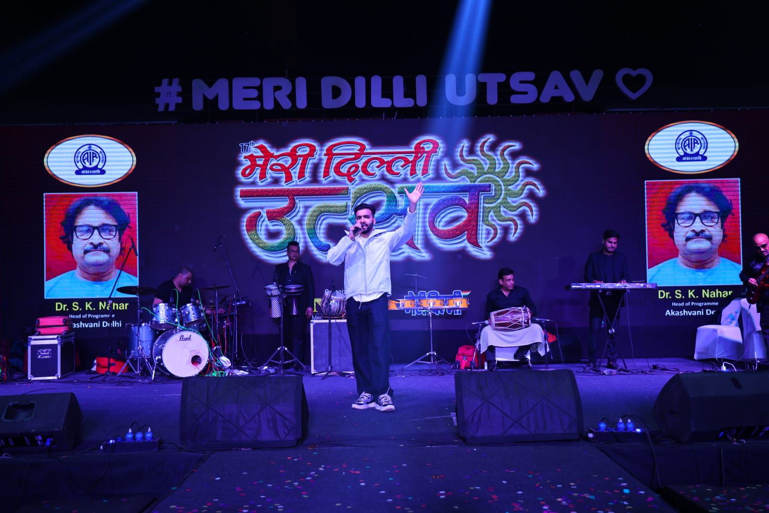 Revaansh Kohli performing centre stage with live musicians